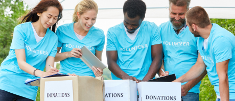 A group of volunteers help with a fundraising event