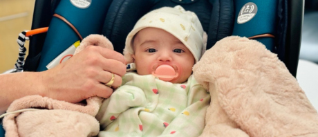 An infant getting a hearing screening using the Madsen® Accuscreen - Newborn Hearing Screener OAE/ABR