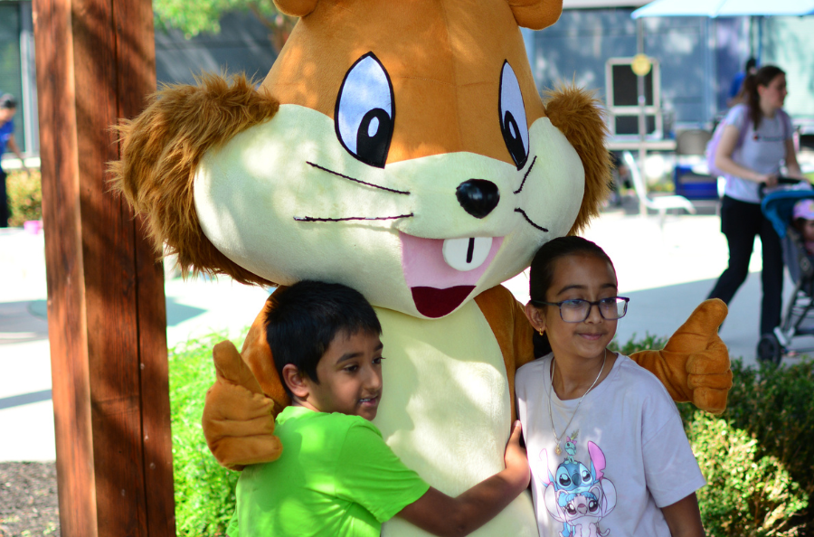 Two ErinoakKids clients give Erin a hug