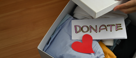 A box with items in it, including a note that says "Donate"