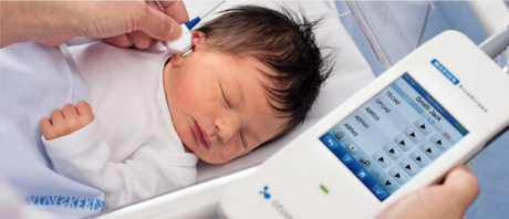An infant getting a hearing screening using the Madsen® Accuscreen - Newborn Hearing Screener OAE/ABR