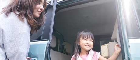Mom ad daughter exiting vehicle
